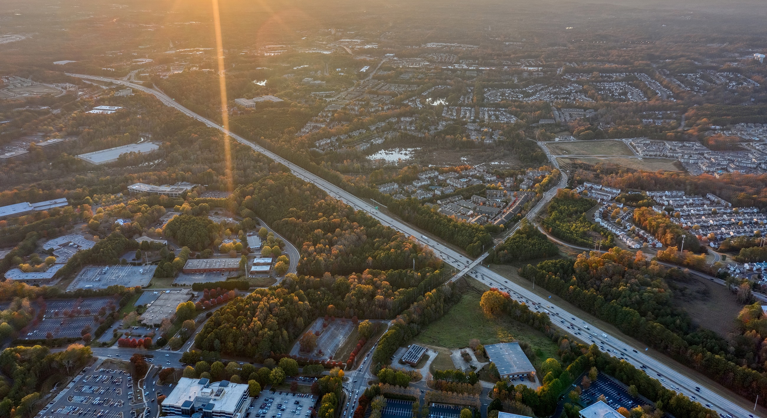 Aerial view of roads and suburban landscape.